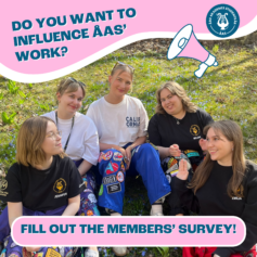 members' survey, ad. the board sits on green grass and smiles