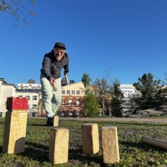 a person playing kubb