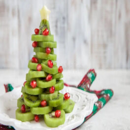 healthy-dessert-idea-kids-party-funny-edible-kiwi-pomegranate-christmas-tree-beautiful-new-year-background-10203736455