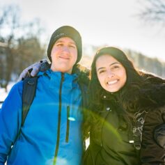 Two people smiling at the camera